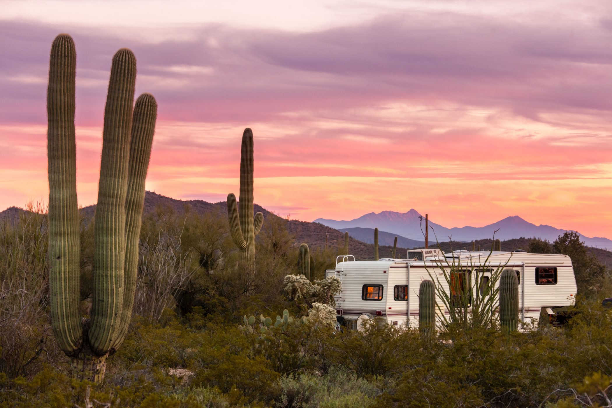 The meme is a humorous image of a desert landscape with a few cacti and a large, imposing mountain in the background. The text "I can see for miles and miles" is written in a small, childlike font at the top of the image, while the text "I can see my house from here" is written in a similar font at the bottom. The image is a playful reference to the classic phrase "I can see my house from here," which is often used to describe a person's ability to see their home from a great distance.